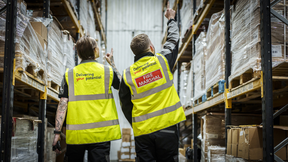 WBS employees in warehouse with branded vests